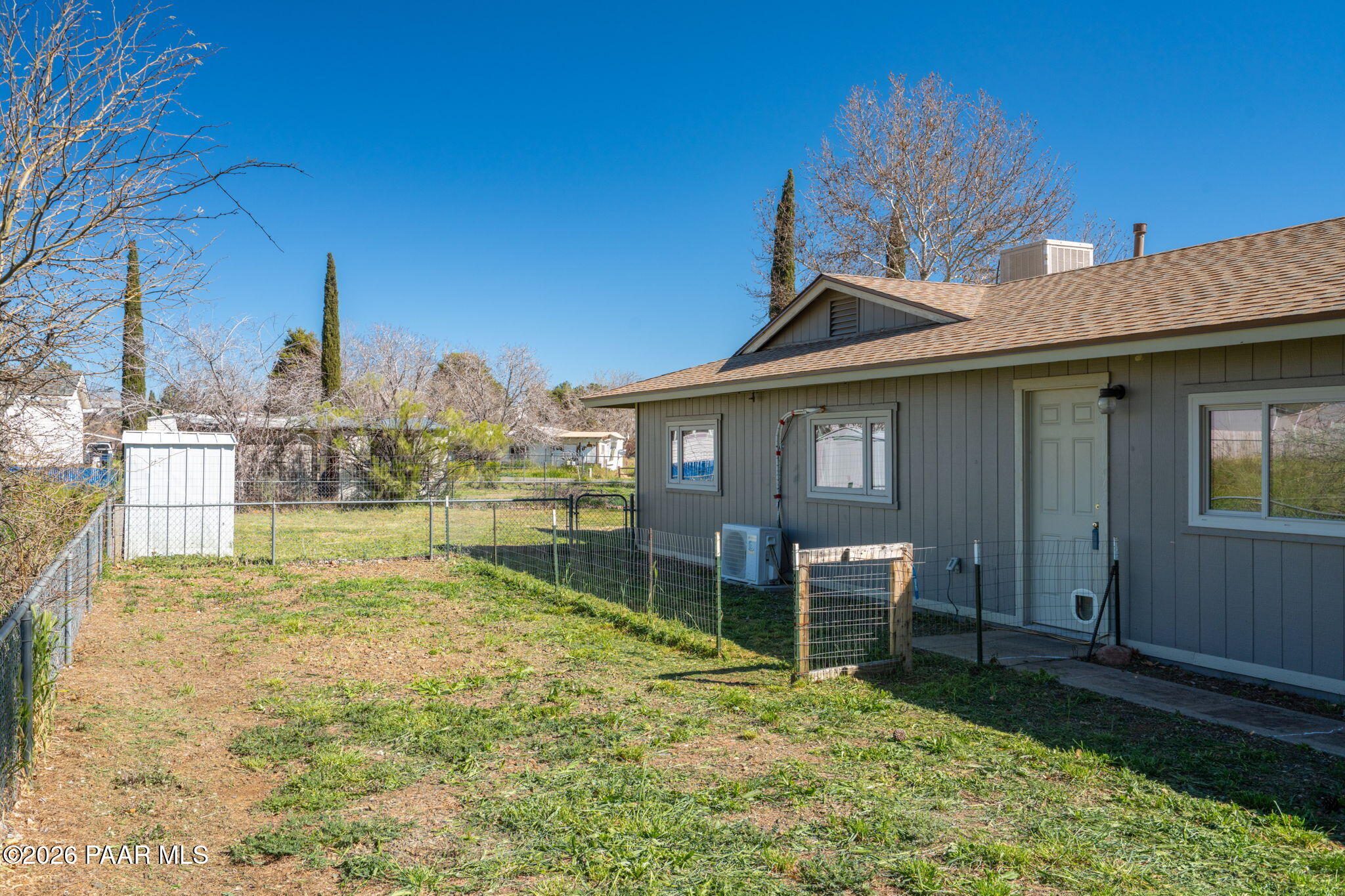 17270 East Peach Tree Road Mayer, AZ 86333 - Photo 31 of 31 a backyard of a house with table and chairs