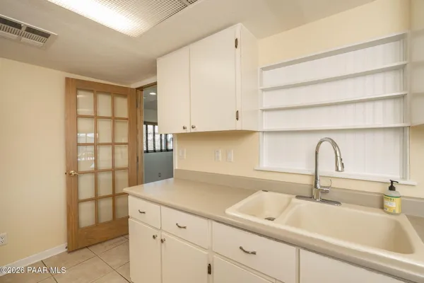 a kitchen with a sink and cabinets