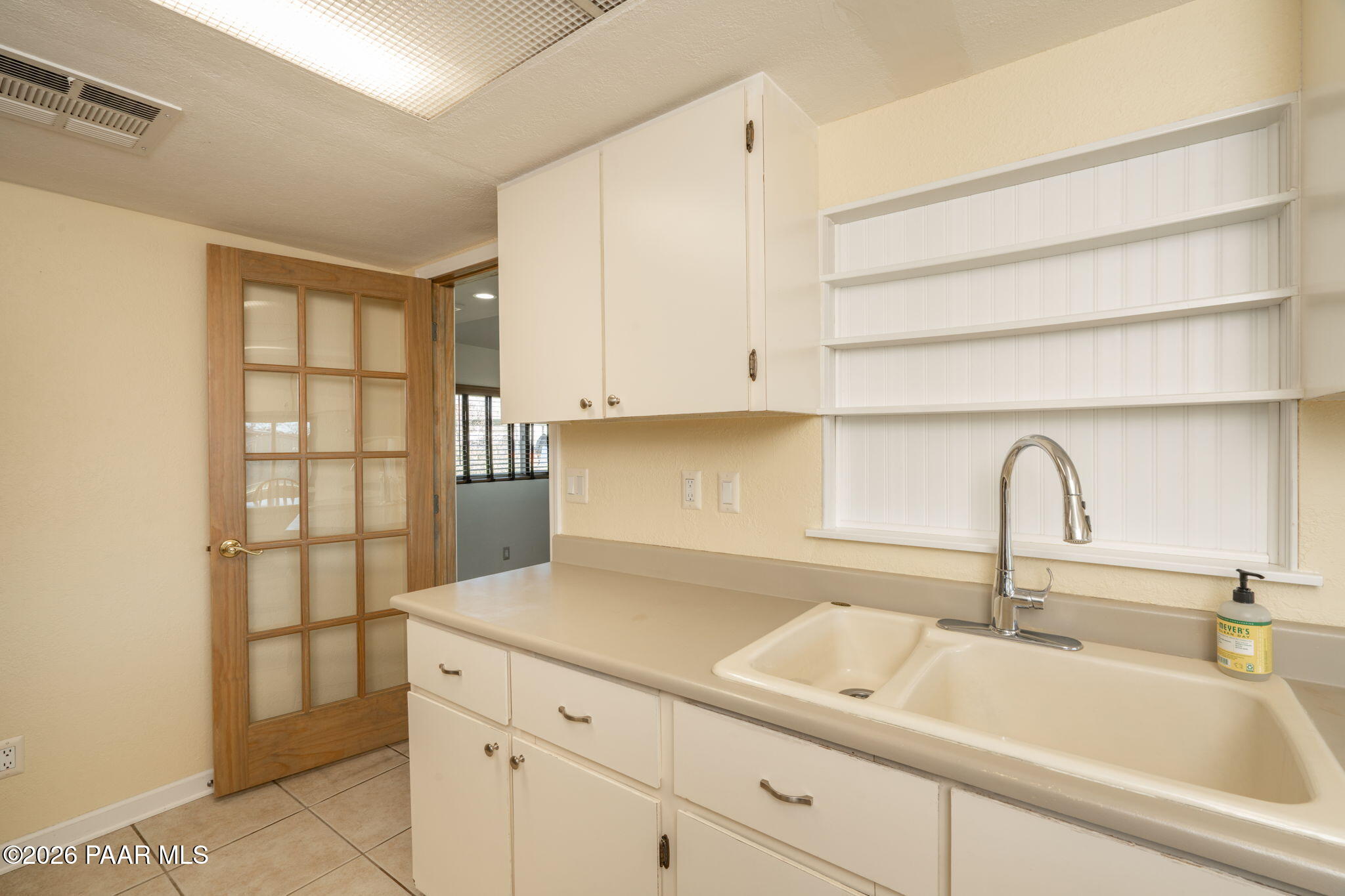 17270 East Peach Tree Road Mayer, AZ 86333 - Photo 9 of 31 a kitchen with a sink and cabinets
