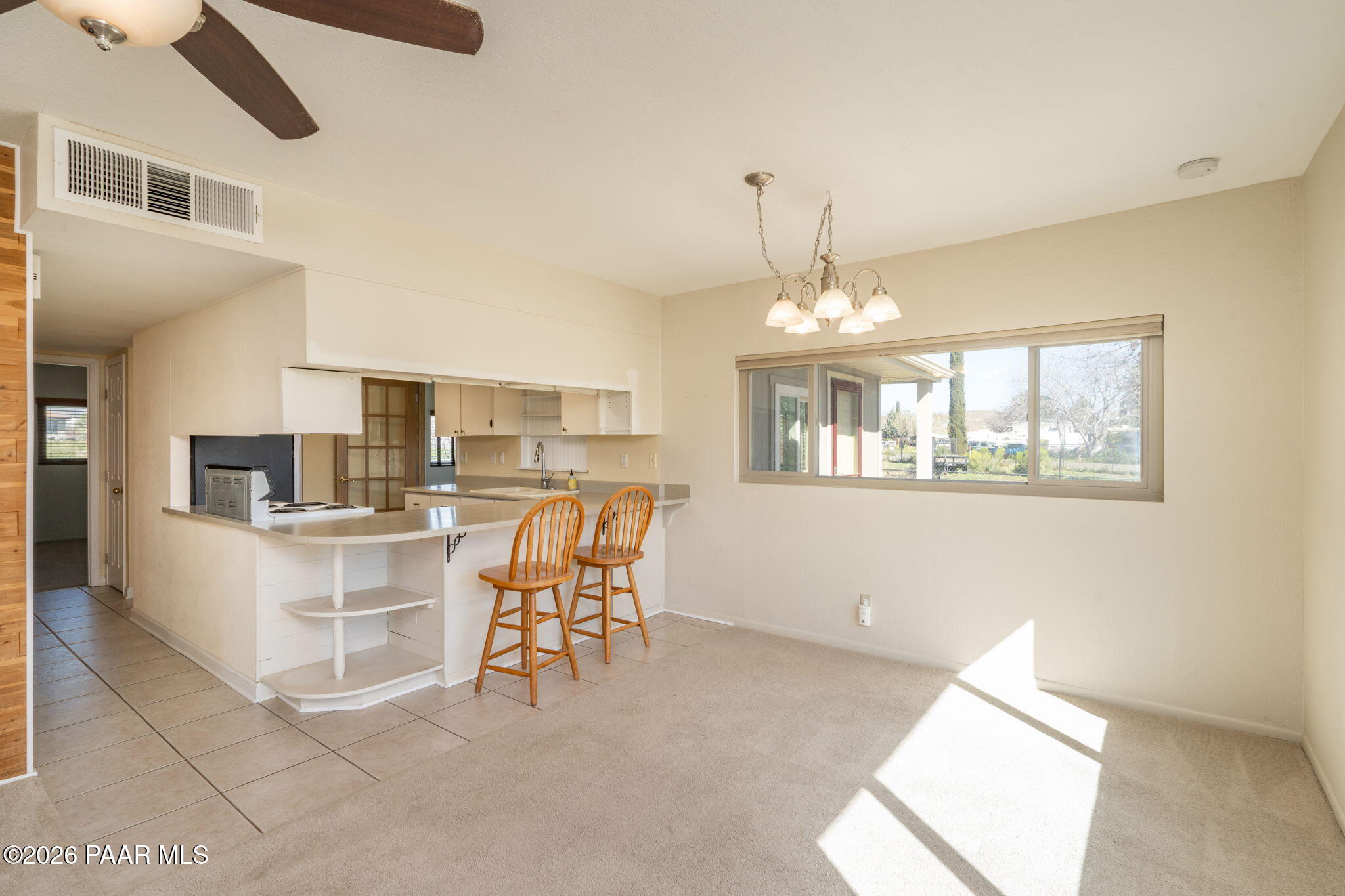 17270 East Peach Tree Road Mayer, AZ 86333 - Photo 10 of 31 a view of a dining room with furniture and chandelier