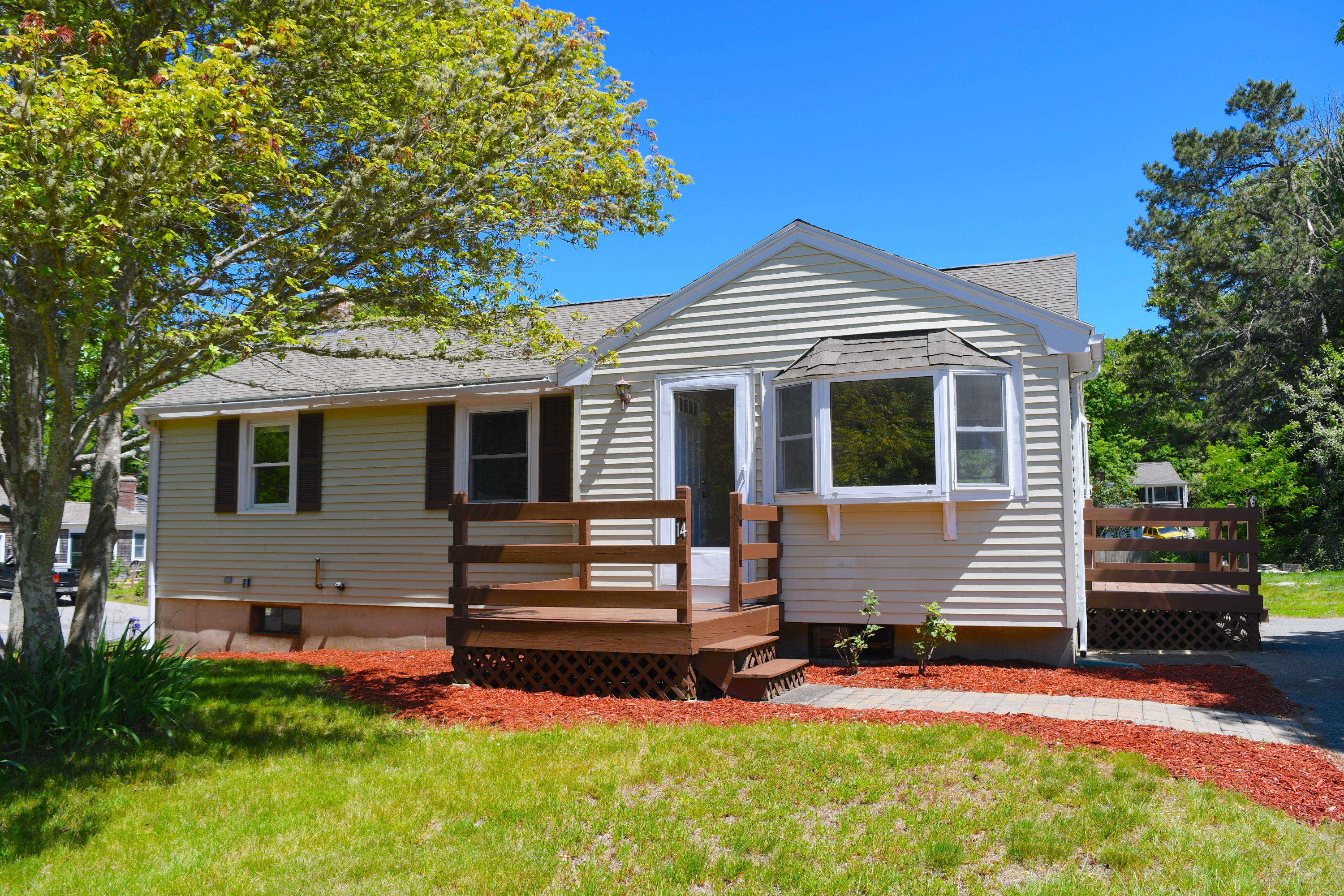 14 Marilyn Road Buzzards Bay, MA 02532 - Photo 19 of 20 a front view of a house with a yard