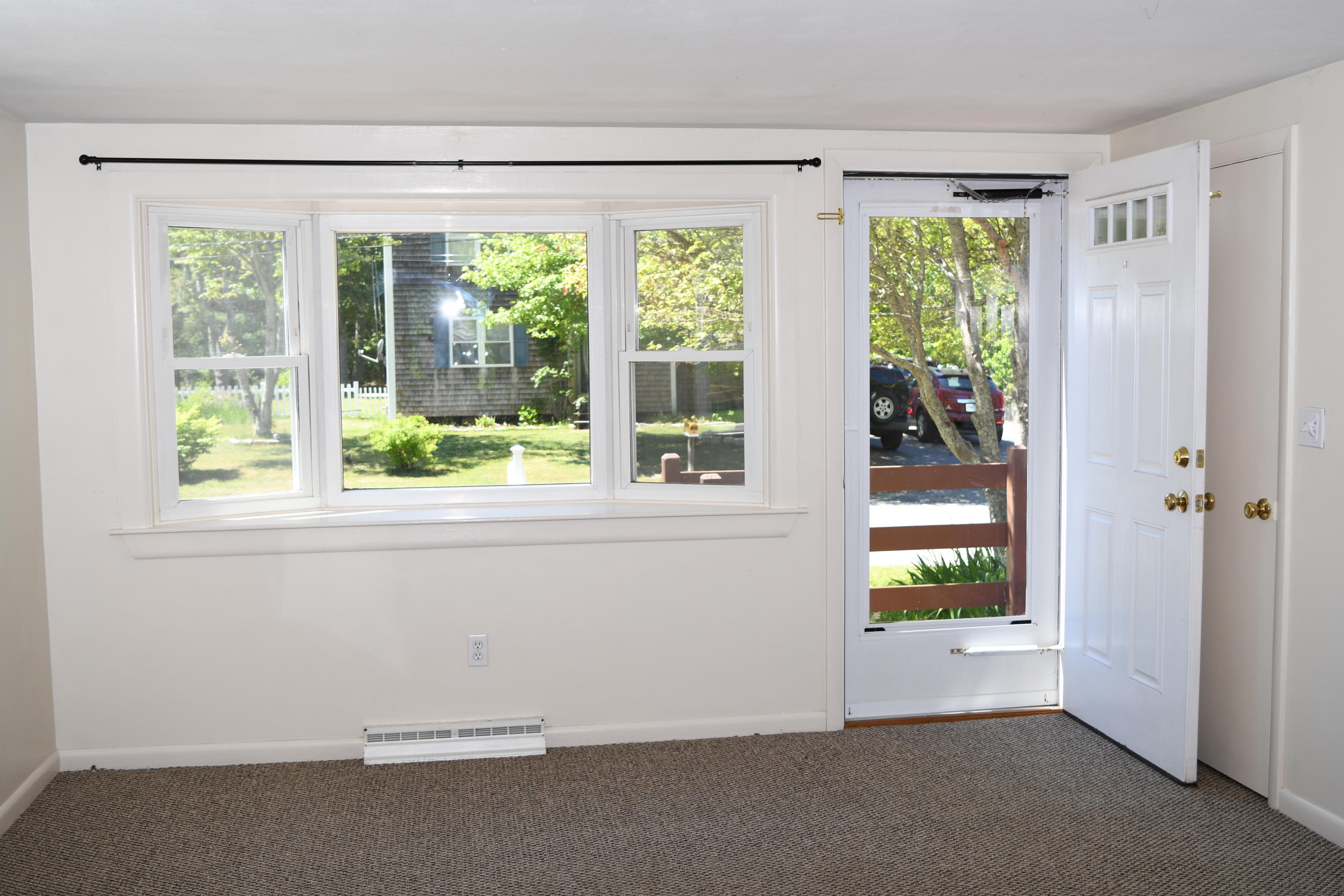 14 Marilyn Road Buzzards Bay, MA 02532 - Photo 7 of 20 an empty room with windows and outdoor view