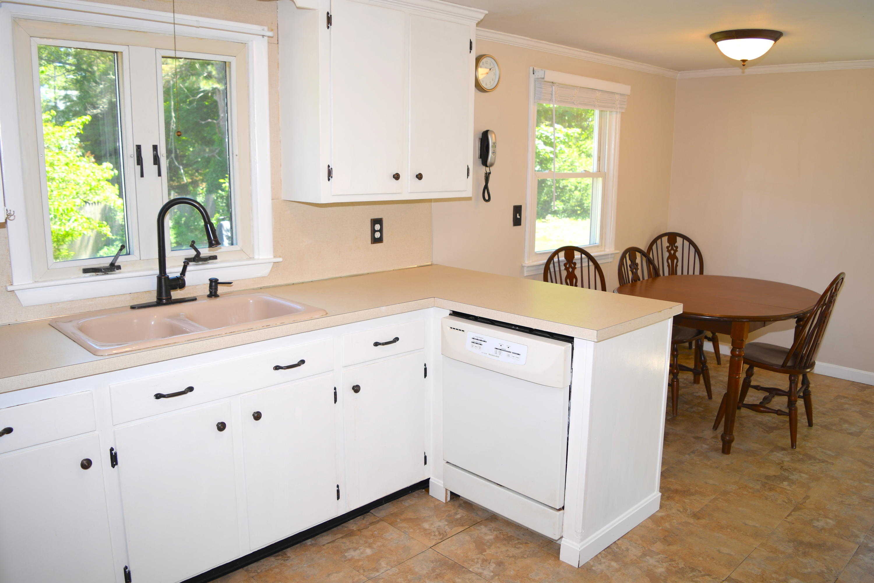 14 Marilyn Road Buzzards Bay, MA 02532 - Photo 10 of 20 a kitchen with granite countertop white cabinets and a large window