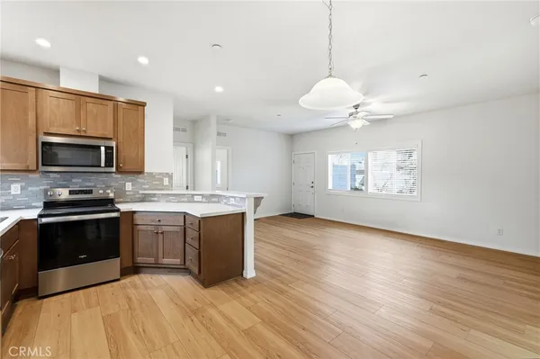 a view of kitchen with wooden floor