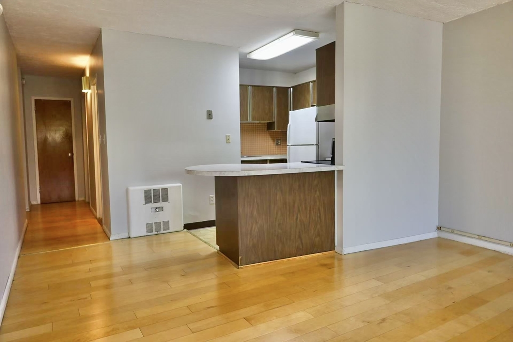 200 Swanton Street, Unit 237 Winchester, MA 01890 - Photo 4 of 14 a view of a kitchen with a sink