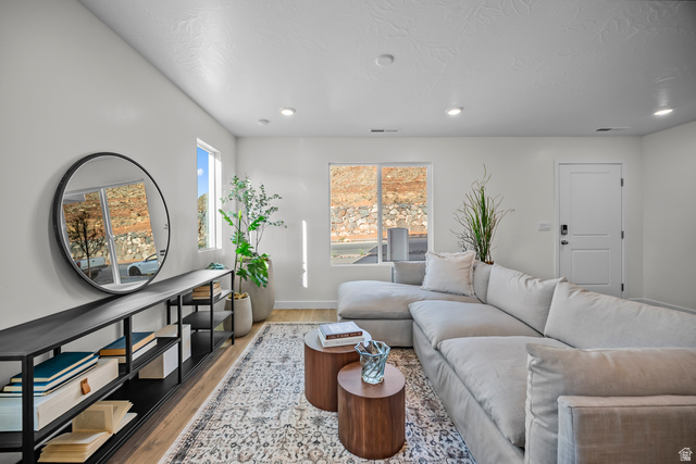 2202 Wolverine Way, Unit 2529 Washington, UT 84780 - Photo 11 of 27 Bright living area featuring light-toned walls, recessed lighting, and wood-finish flooring