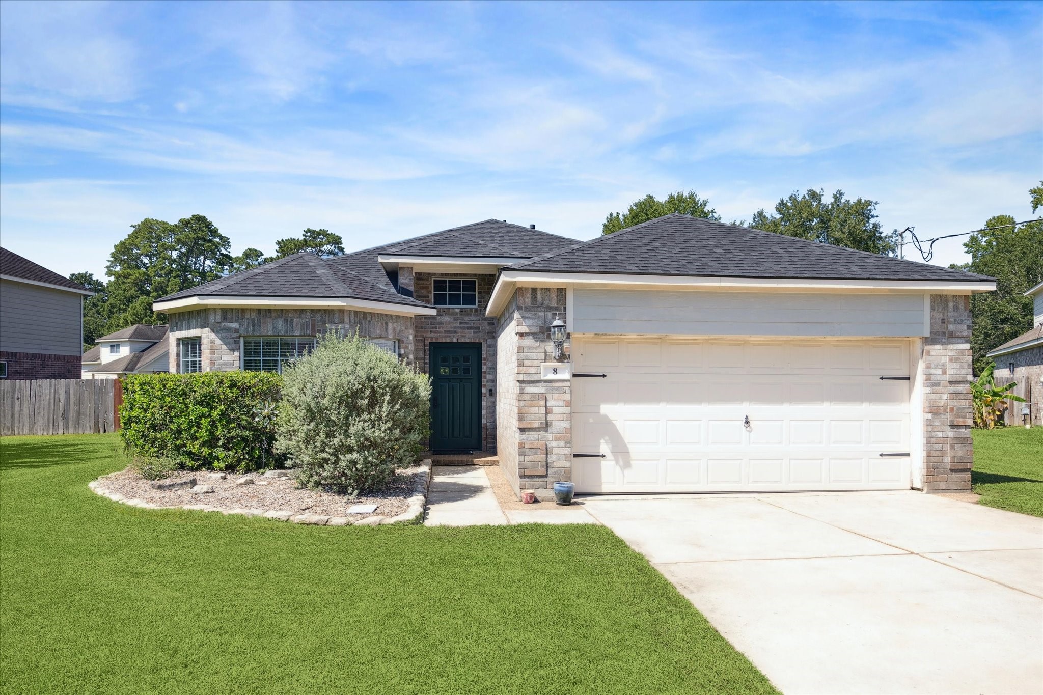 8 Pineway Conroe, TX 77304 - Photo 1 of 20 a front view of a house with a yard