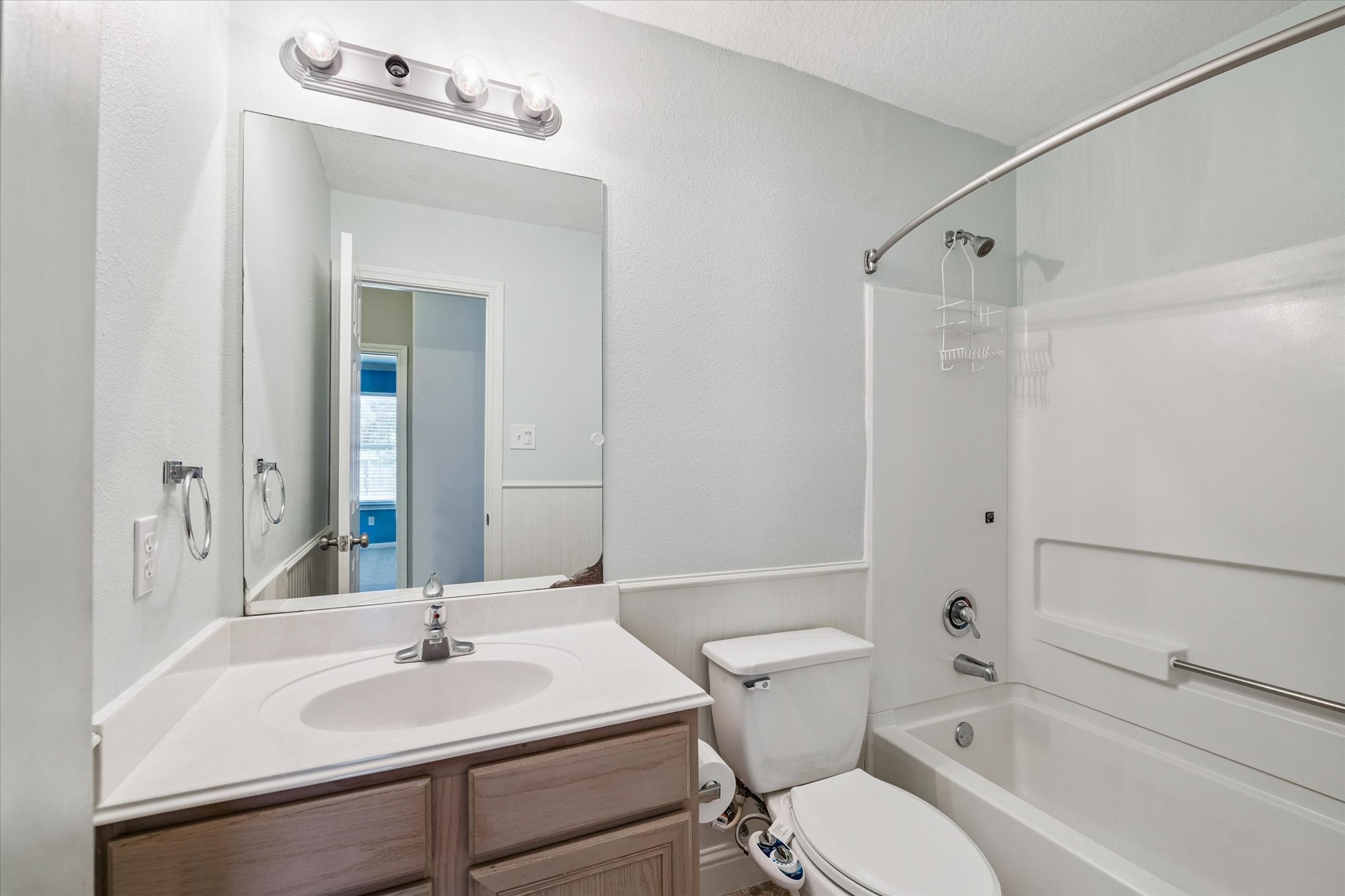 8 Pineway Conroe, TX 77304 - Photo 15 of 20 a bathroom with a sink vanity mirror and toilet
