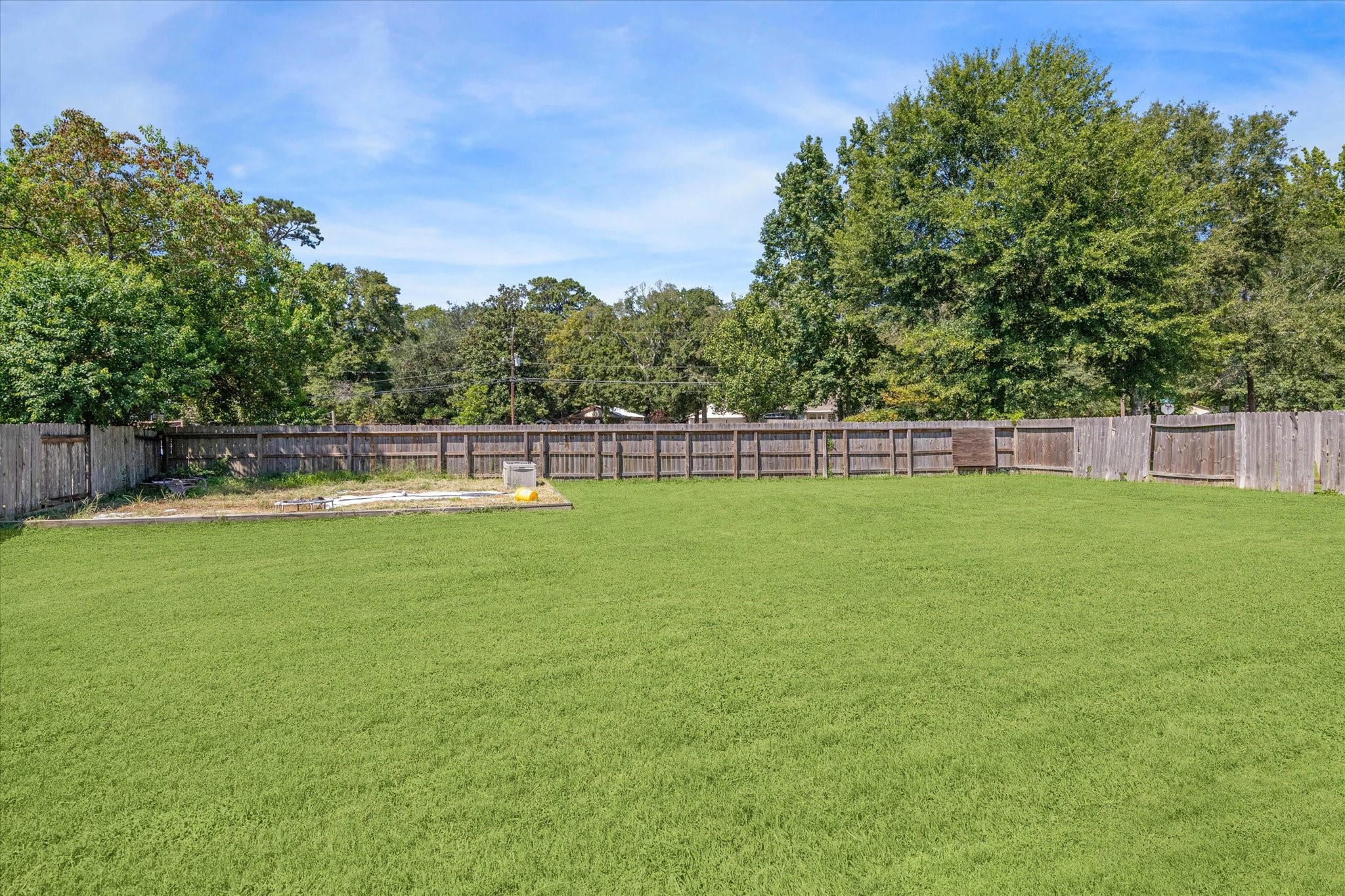 8 Pineway Conroe, TX 77304 - Photo 17 of 20 a view of outdoor space with deck and yard