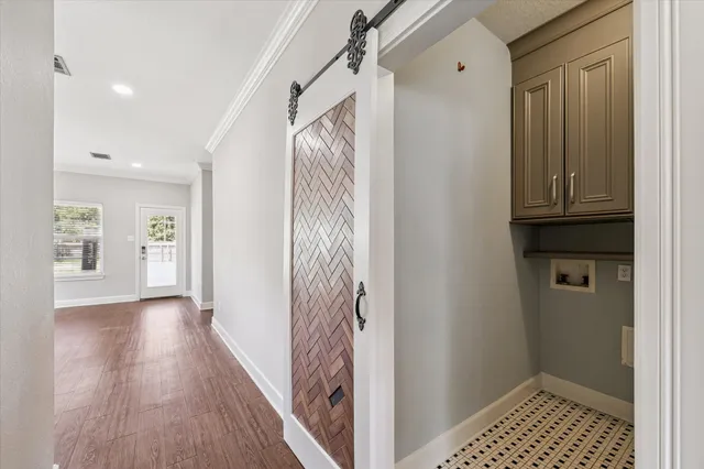 a view of hallway with wooden floor