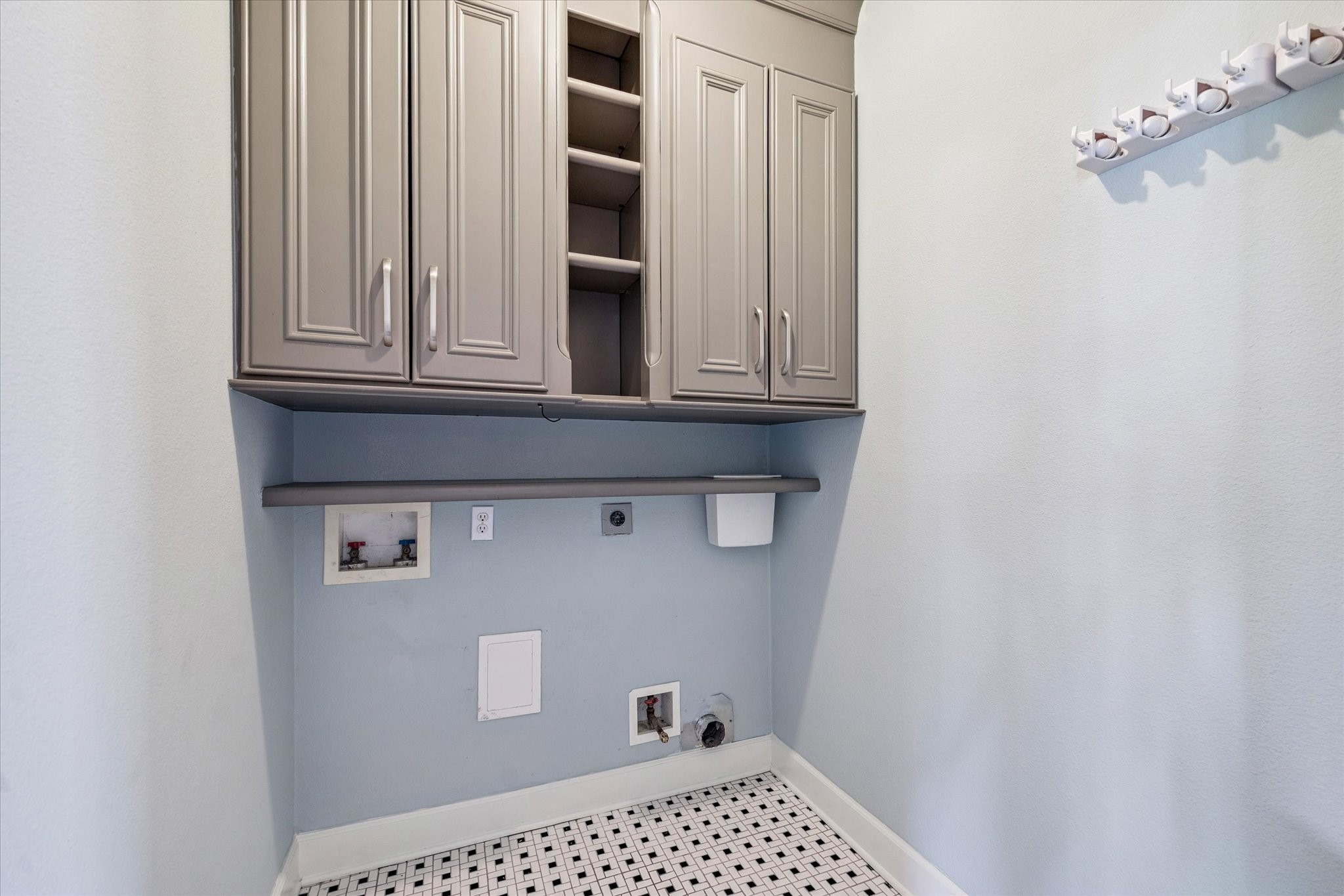 8 Pineway Conroe, TX 77304 - Photo 9 of 20 a cabinet sitting in a bathroom next to a cabinet