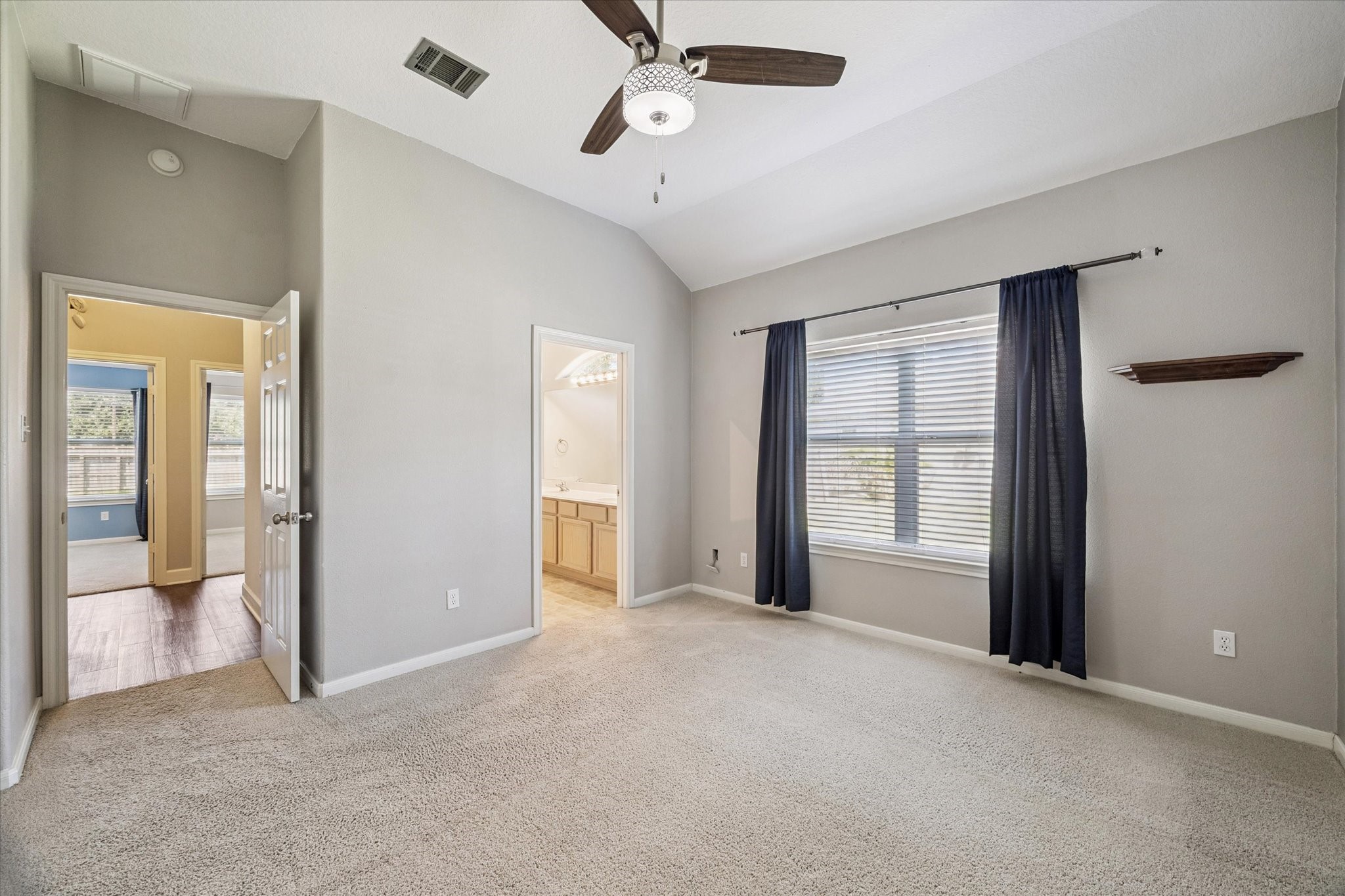 8 Pineway Conroe, TX 77304 - Photo 10 of 20 a view of an empty room with a window