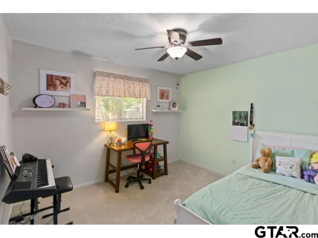 a bedroom with a workspace