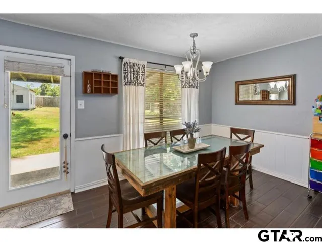 a view of a dining room with furniture window and outside view