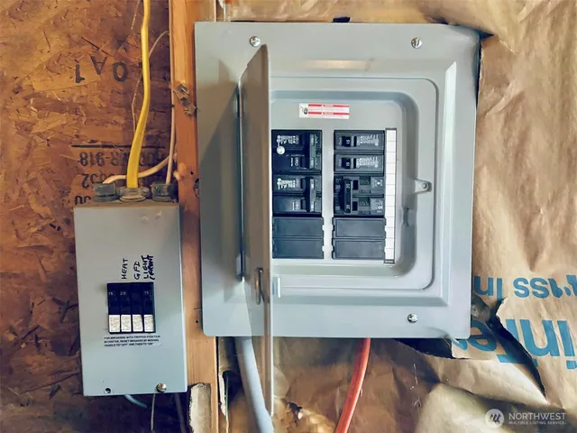 a toilet sitting in a bathroom next to a blue wall