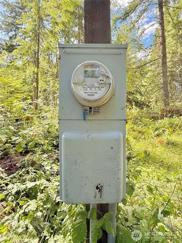 a view of a lake in middle of green field