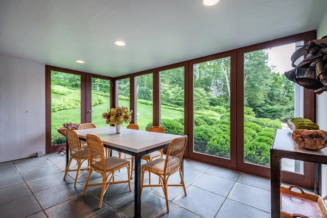 a view of a dining room with furniture window and outside view