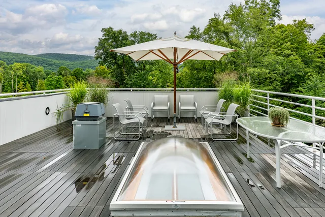 swimming pool view with a seating space