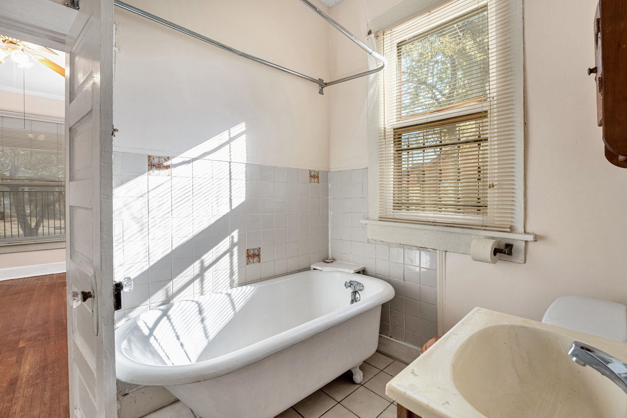 1033 Bruce Street Memphis, TN 38104 - Photo 11 of 19 a bathroom with a tub and a sink