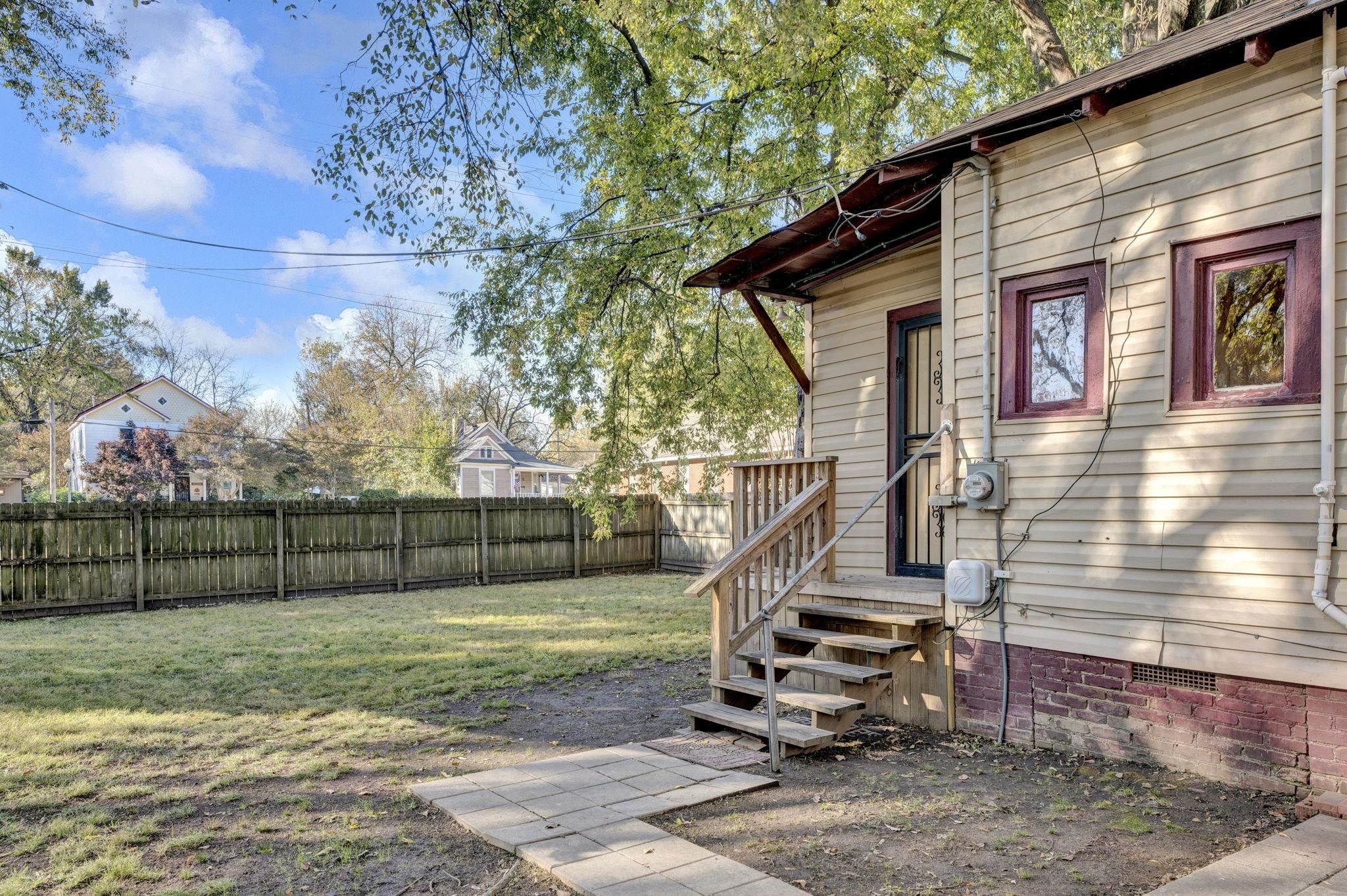 1033 Bruce Street Memphis, TN 38104 - Photo 16 of 19 a view of a small yard and wooden fence