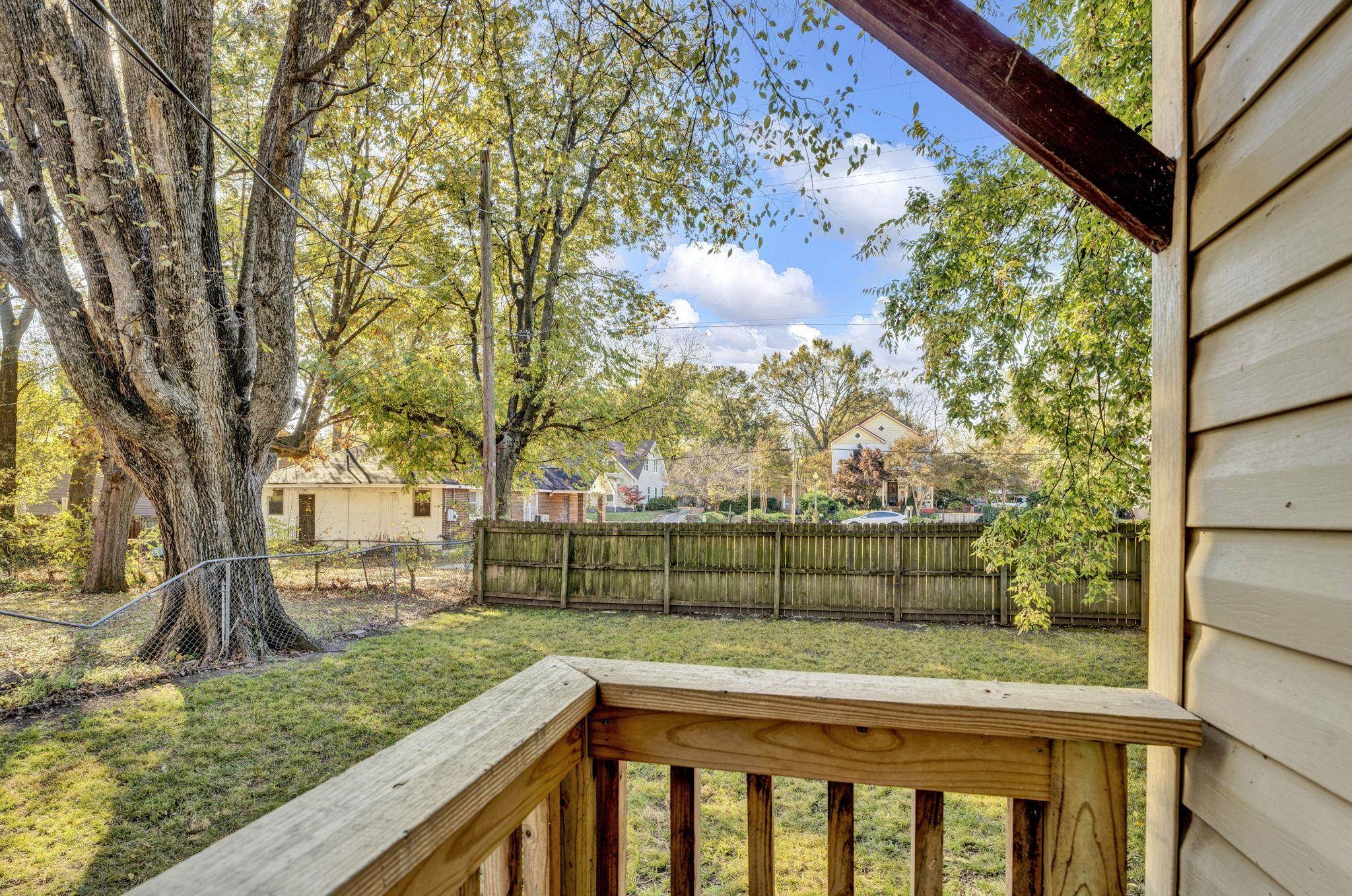 1033 Bruce Street Memphis, TN 38104 - Photo 17 of 19 a view of backyard with wooden fence