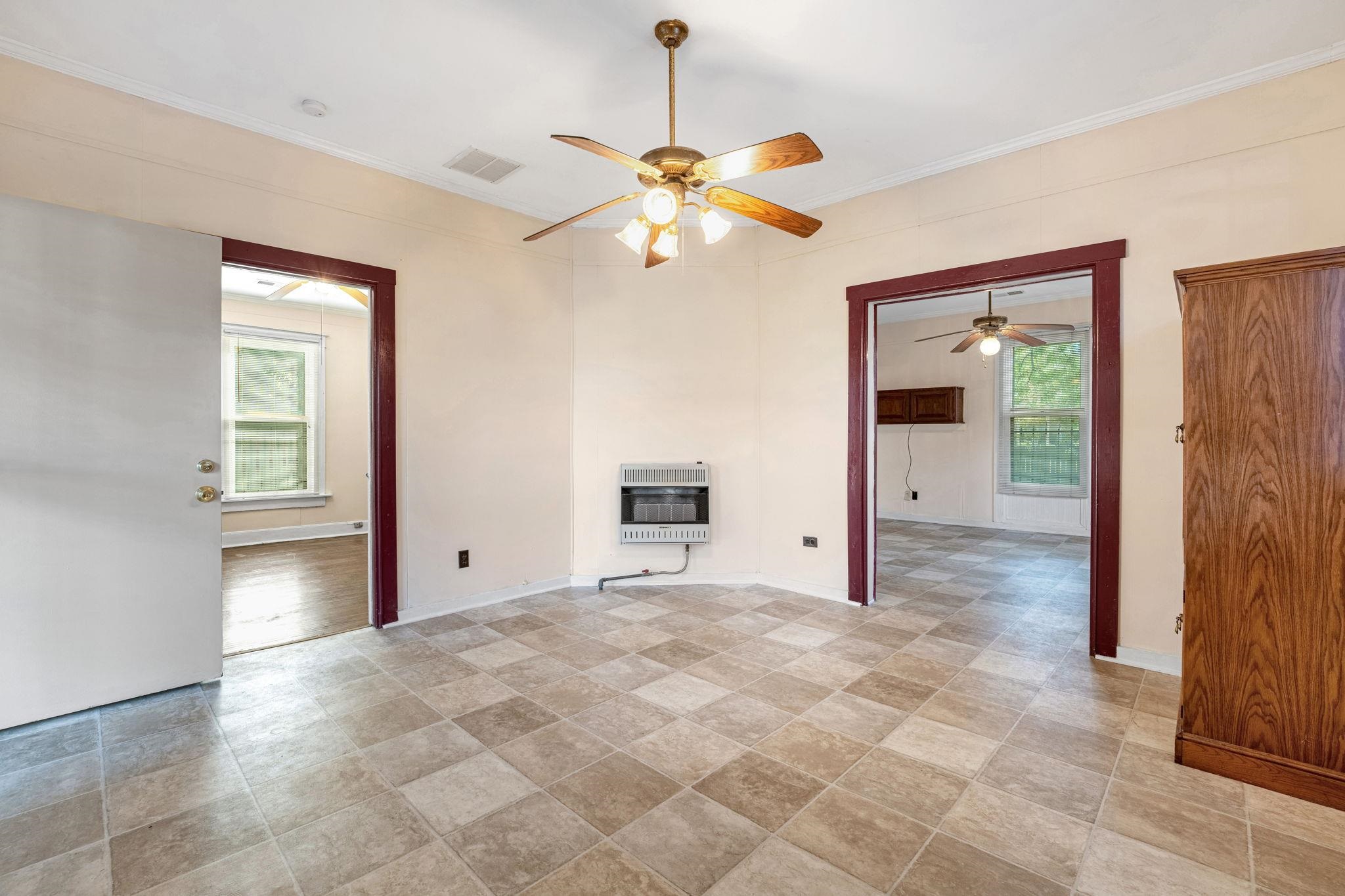 1033 Bruce Street Memphis, TN 38104 - Photo 3 of 19 a view of a livingroom with a chandelier fan and windows