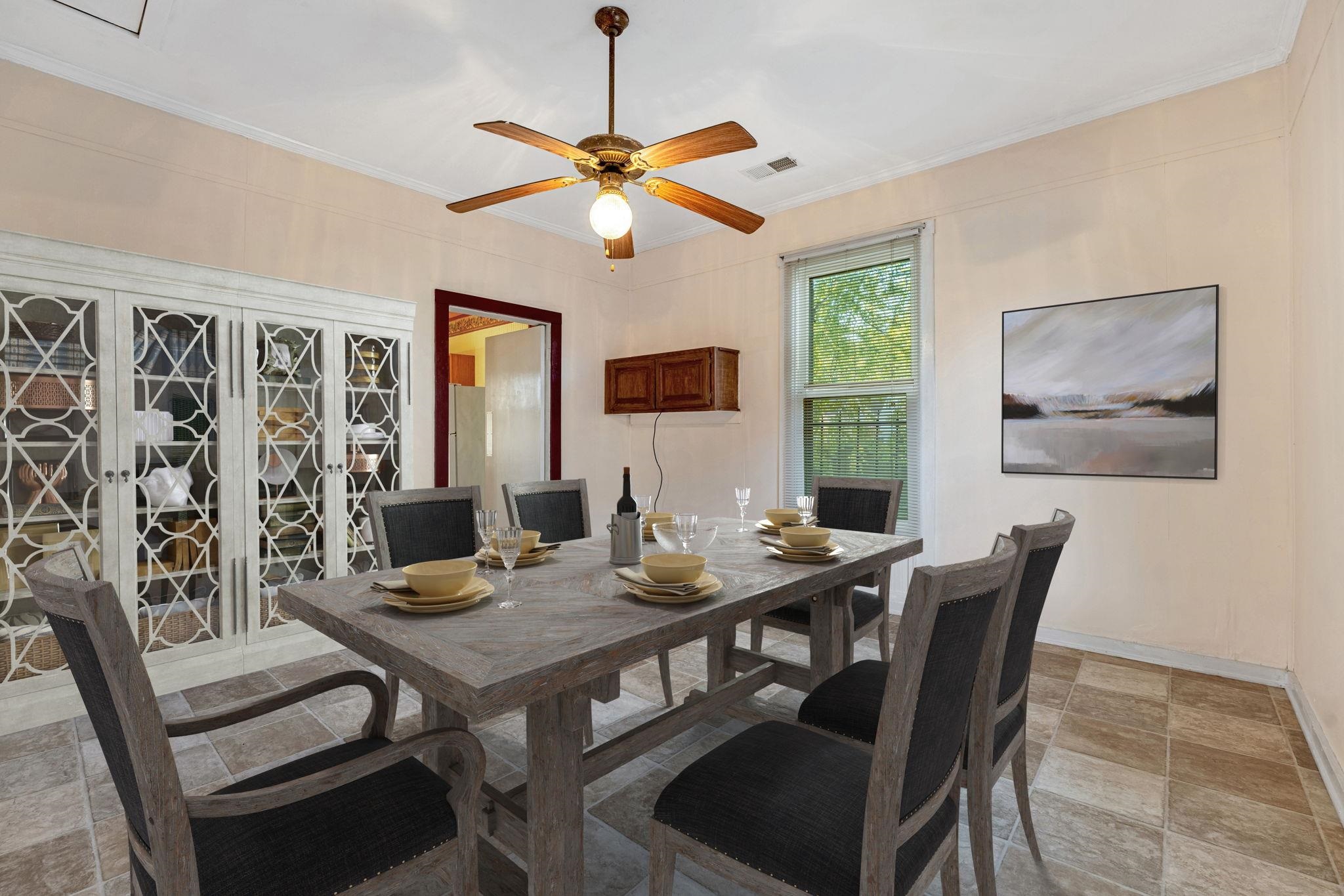 1033 Bruce Street Memphis, TN 38104 - Photo 5 of 19 a view of a dining room with furniture window and wooden floor