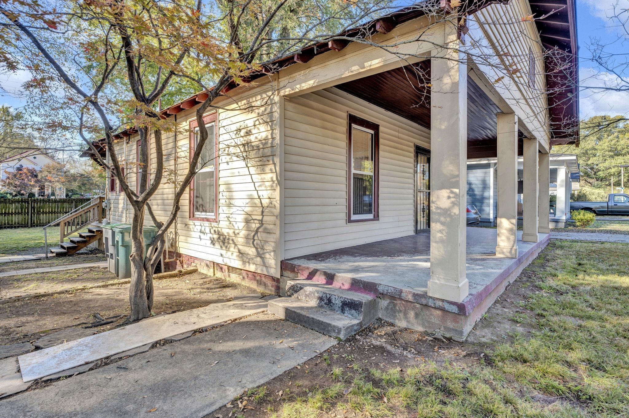 1033 Bruce Street Memphis, TN 38104 - Photo 7 of 19 a view of a house with a yard and large tree