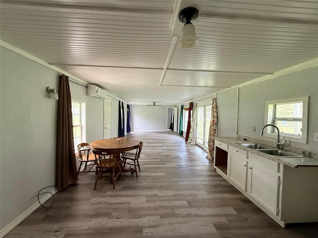 7729 Cutter Drive Frankston, TX 75763 - Photo 13 of 32 a kitchen with stainless steel appliances granite countertop a sink and wooden floors