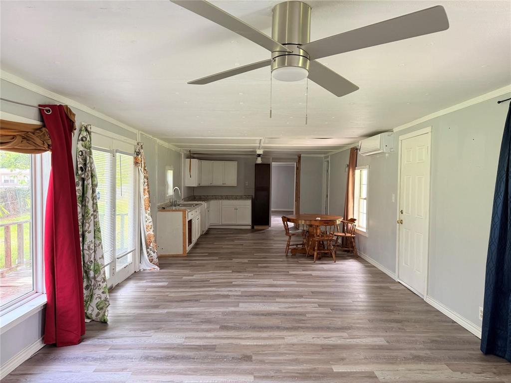 7729 Cutter Drive Frankston, TX 75763 - Photo 16 of 32 a view of a dining room with furniture window and wooden floor