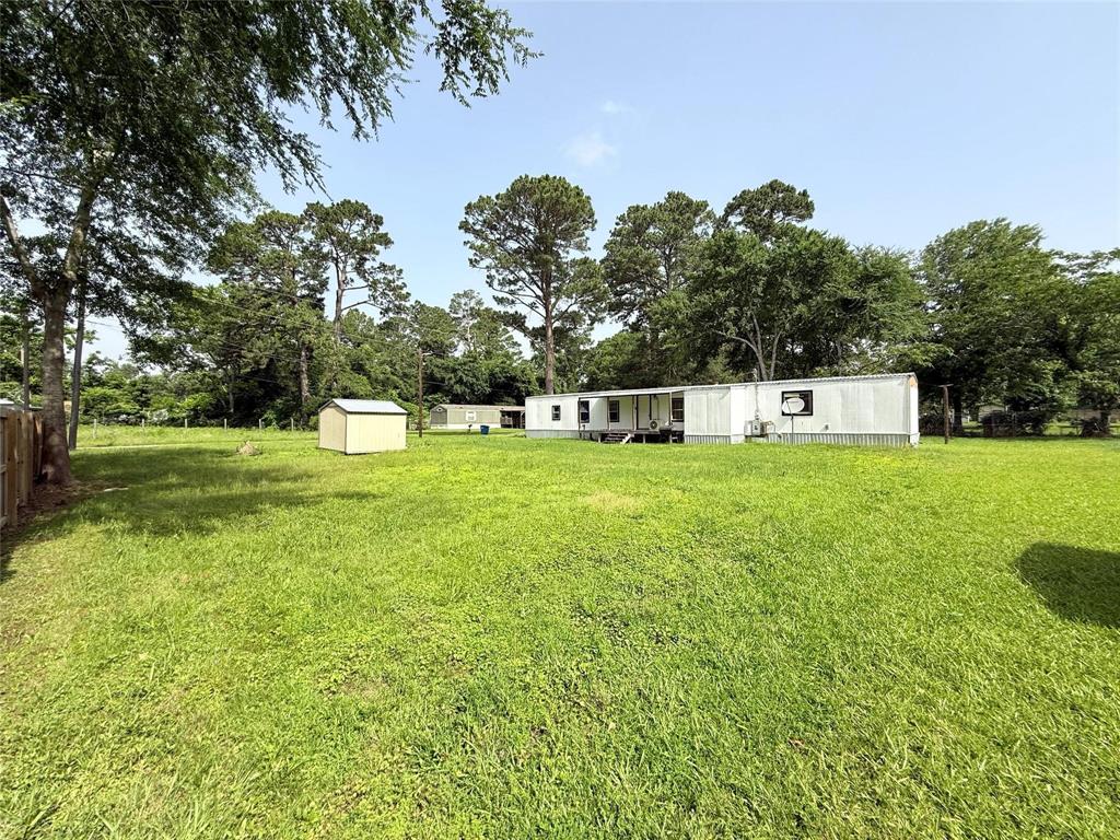 7729 Cutter Drive Frankston, TX 75763 - Photo 2 of 32 a view of a house with a big yard and large trees