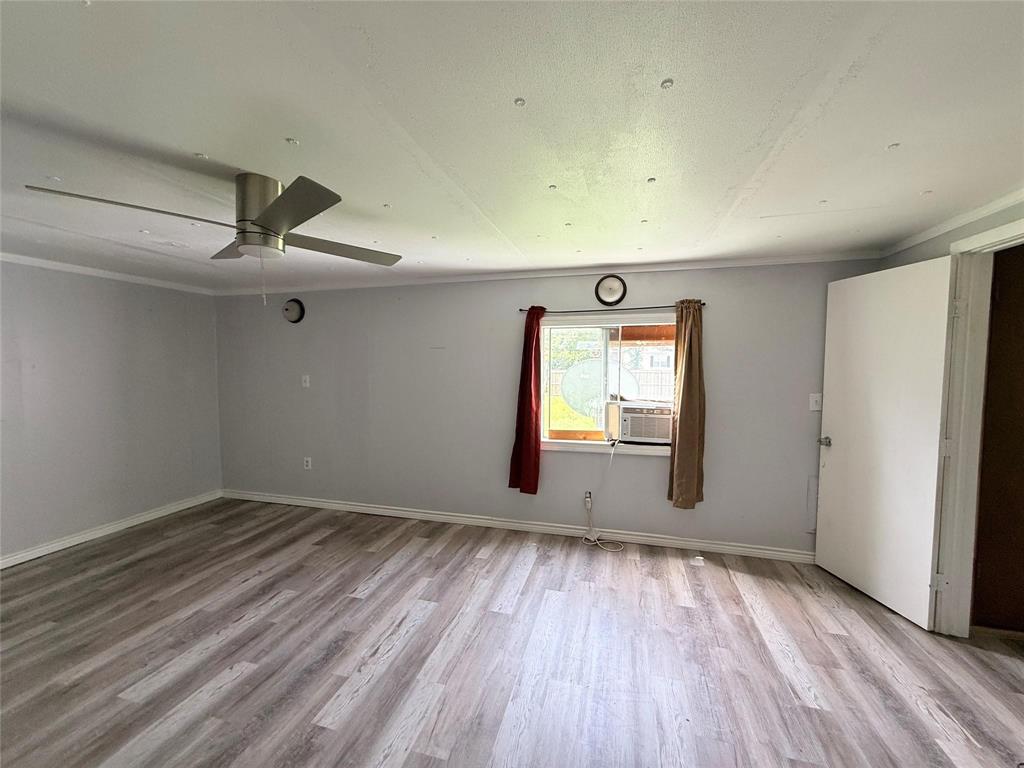 7729 Cutter Drive Frankston, TX 75763 - Photo 26 of 32 a view of empty room with wooden floor and fan