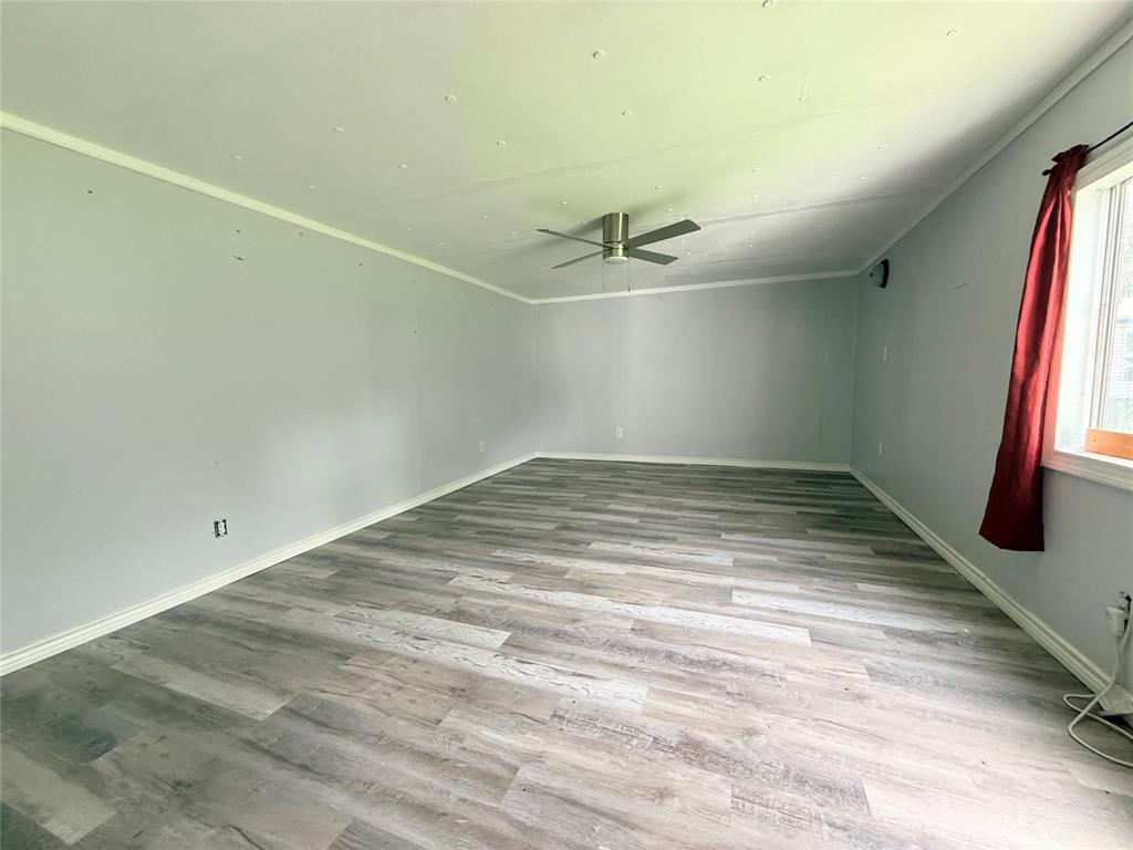 7729 Cutter Drive Frankston, TX 75763 - Photo 28 of 32 a view of a room with window and a ceiling fan