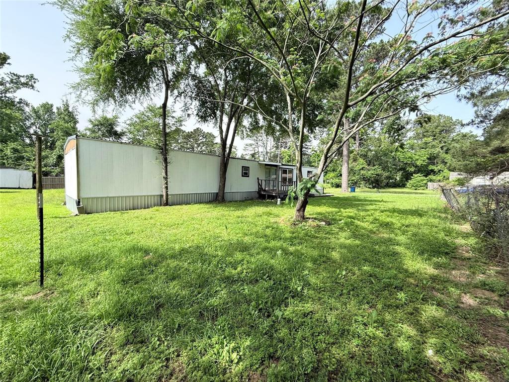 7729 Cutter Drive Frankston, TX 75763 - Photo 7 of 32 a view of a yard with a tree