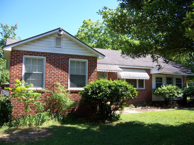 3439 Millerfield Road Macon, GA 31211 - Photo 2 of 15 a front view of a house with a yard