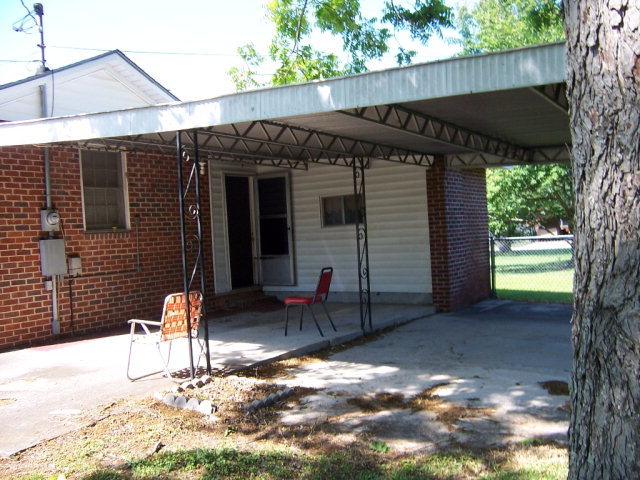 3439 Millerfield Road Macon, GA 31211 - Photo 15 of 15 a backyard of a house with table and chairs