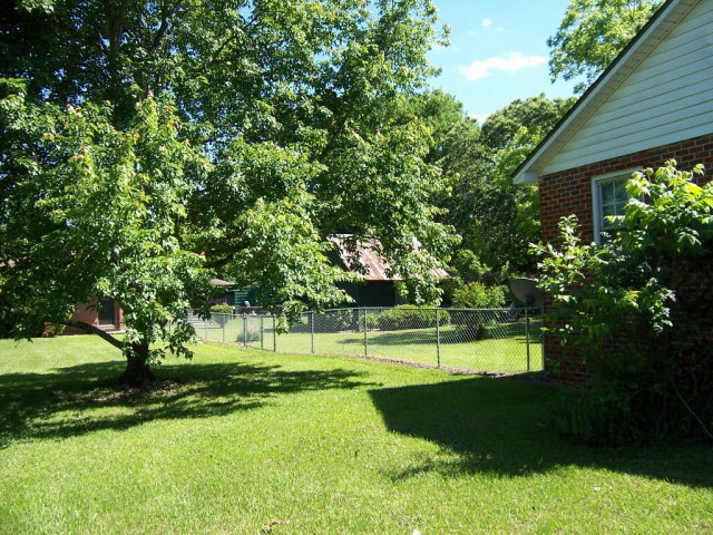 3439 Millerfield Road Macon, GA 31211 - Photo 3 of 15 a view of a park with large trees