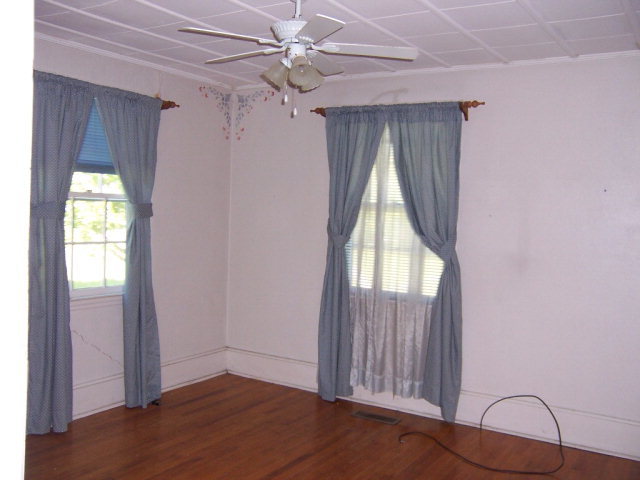 3439 Millerfield Road Macon, GA 31211 - Photo 8 of 15 an empty room with windows and closet
