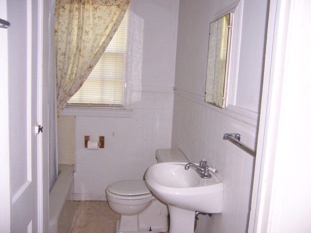 3439 Millerfield Road Macon, GA 31211 - Photo 9 of 15 a bathroom with a sink toilet and a mirror