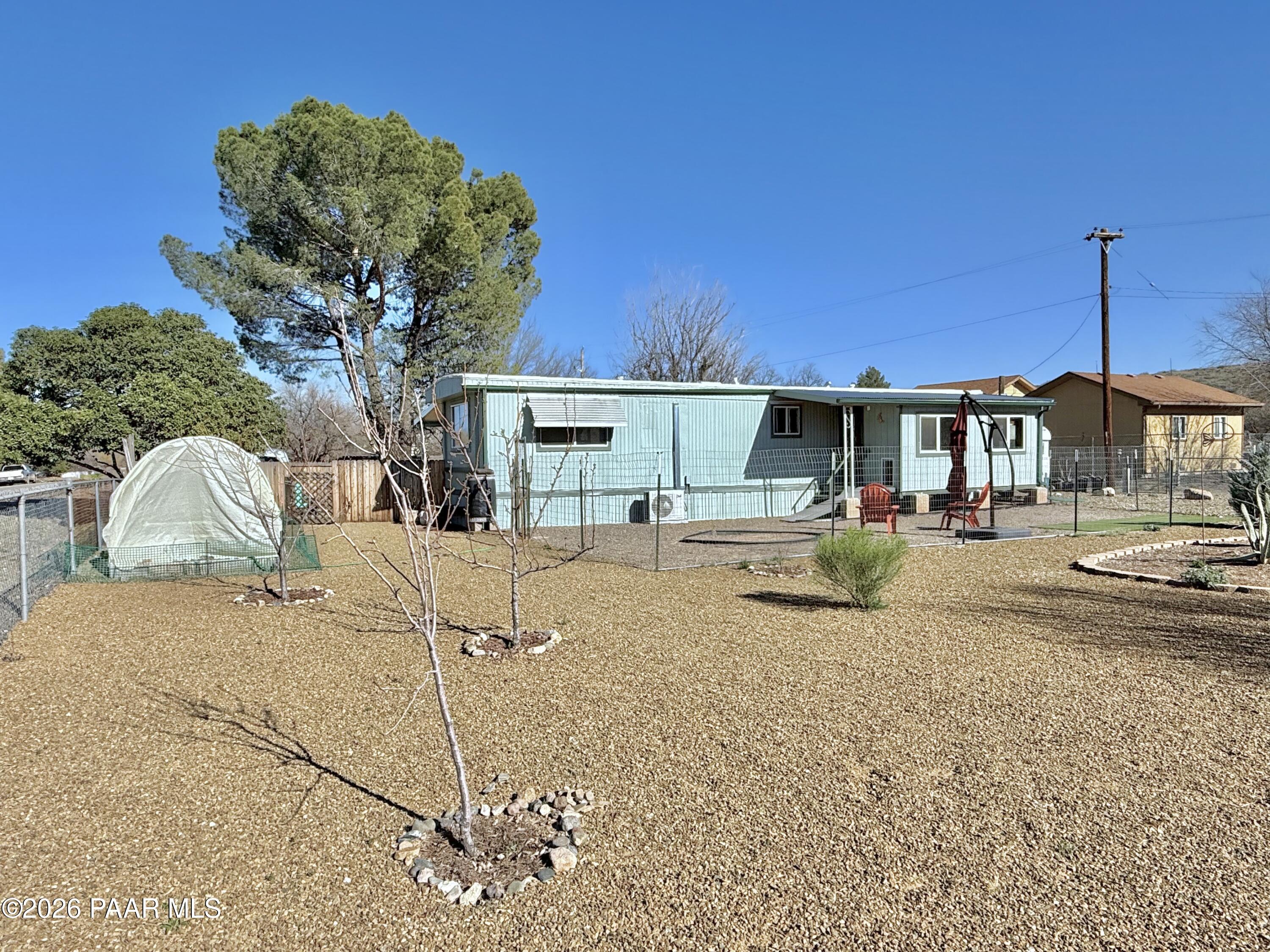 20817 East Butterfield Road Mayer, AZ 86333 - Photo 14 of 24 a view of a house with a patio