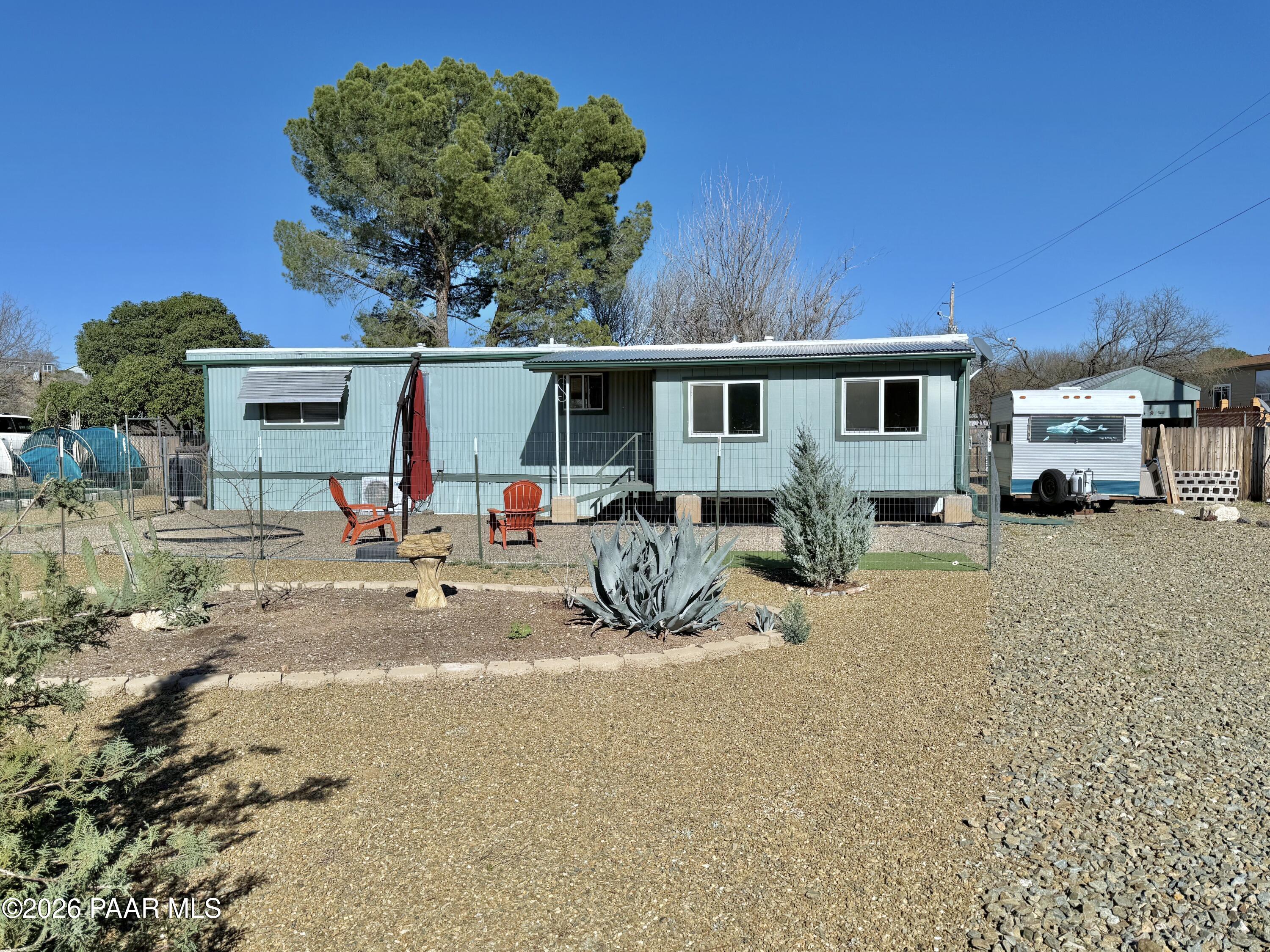 20817 East Butterfield Road Mayer, AZ 86333 - Photo 2 of 24 a view of backyard with a patio and outdoor seating