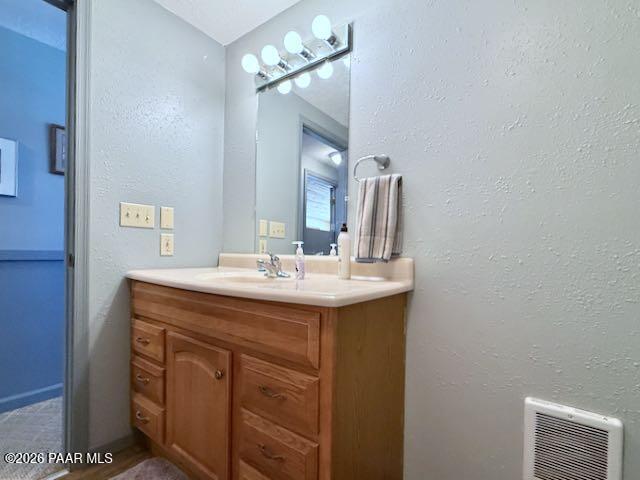 20817 East Butterfield Road Mayer, AZ 86333 - Photo 30 of 47 a bathroom with a sink and a mirror