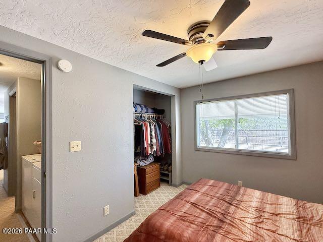 20817 East Butterfield Road Mayer, AZ 86333 - Photo 32 of 47 a bedroom with a bed and a chandelier