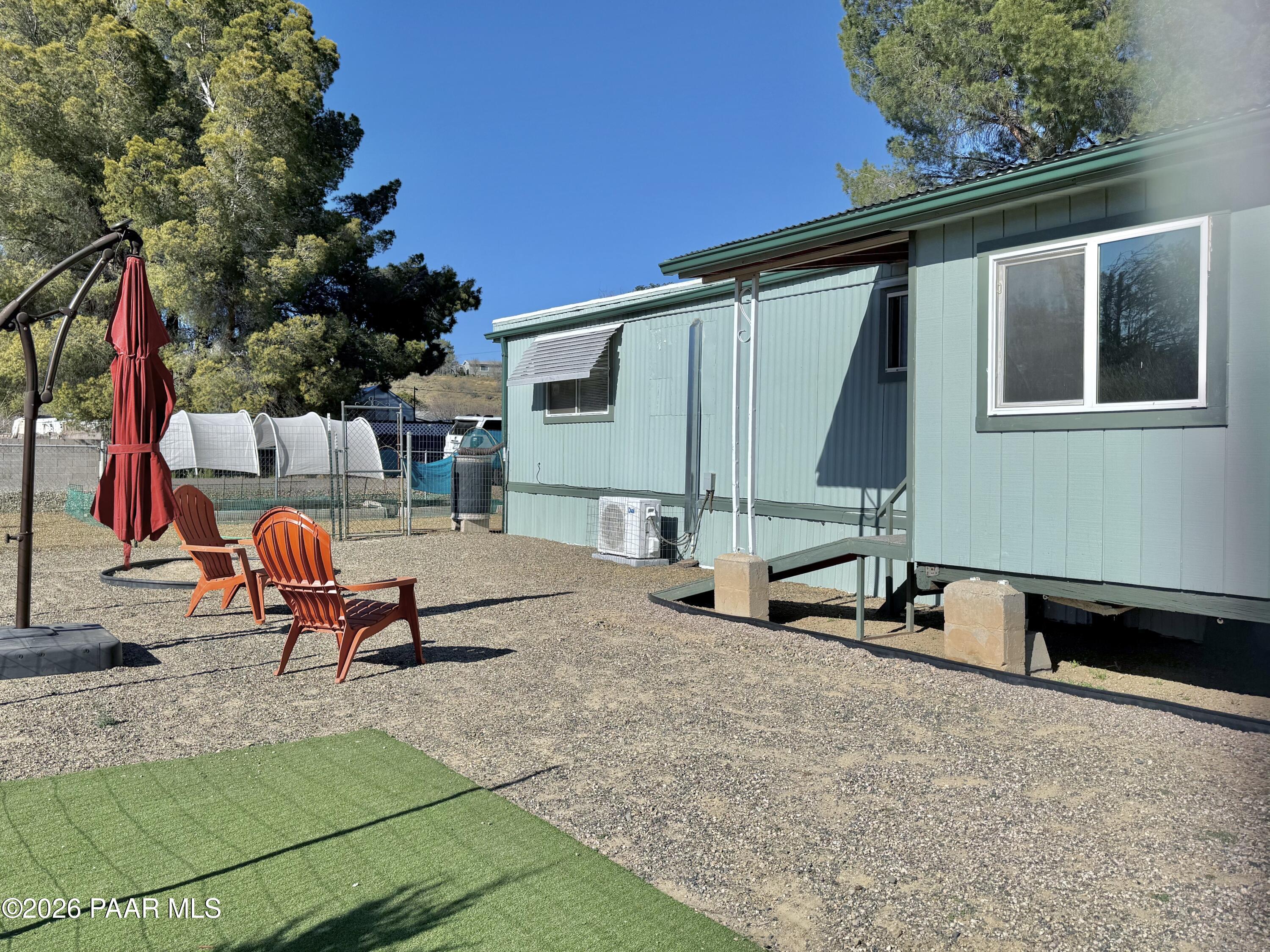 20817 East Butterfield Road Mayer, AZ 86333 - Photo 4 of 24 swimming pool with a bench in front of the house