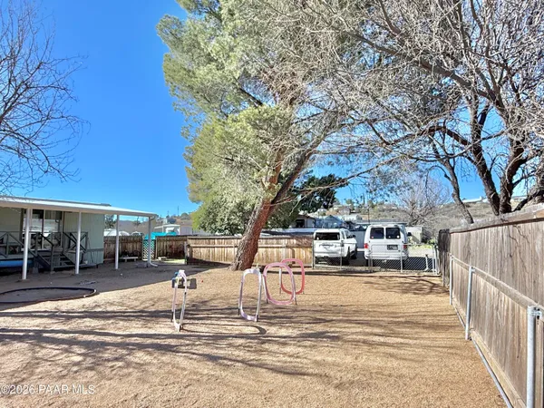 a view of a patio with a yard
