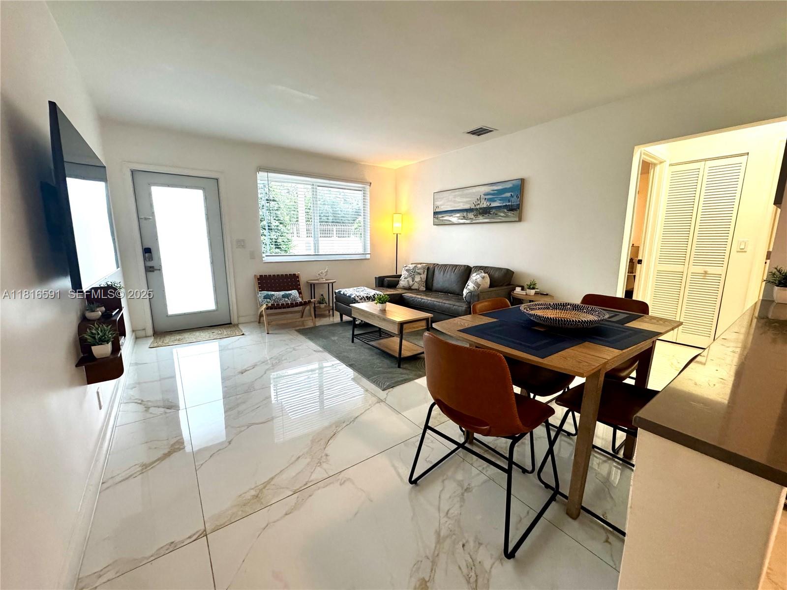1012 Southwest 3rd Avenue Hallandale Beach, FL 33009 - Photo 25 of 35 a living room with furniture and a window