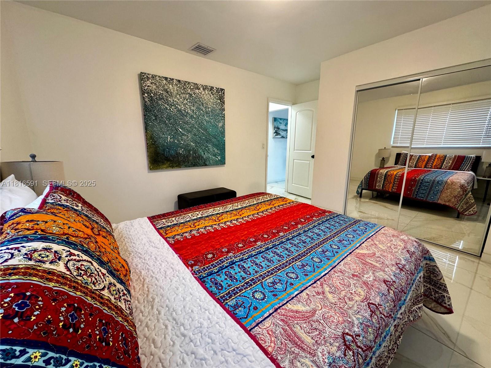 1012 Southwest 3rd Avenue Hallandale Beach, FL 33009 - Photo 29 of 35 a living room with a bed and a table