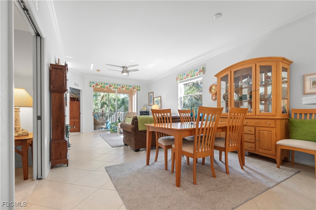 8261 Pathfinder Loop, Unit 730 Fort Myers, FL 33919 - Photo 11 of 40 a view of a dining room with furniture window and outside view