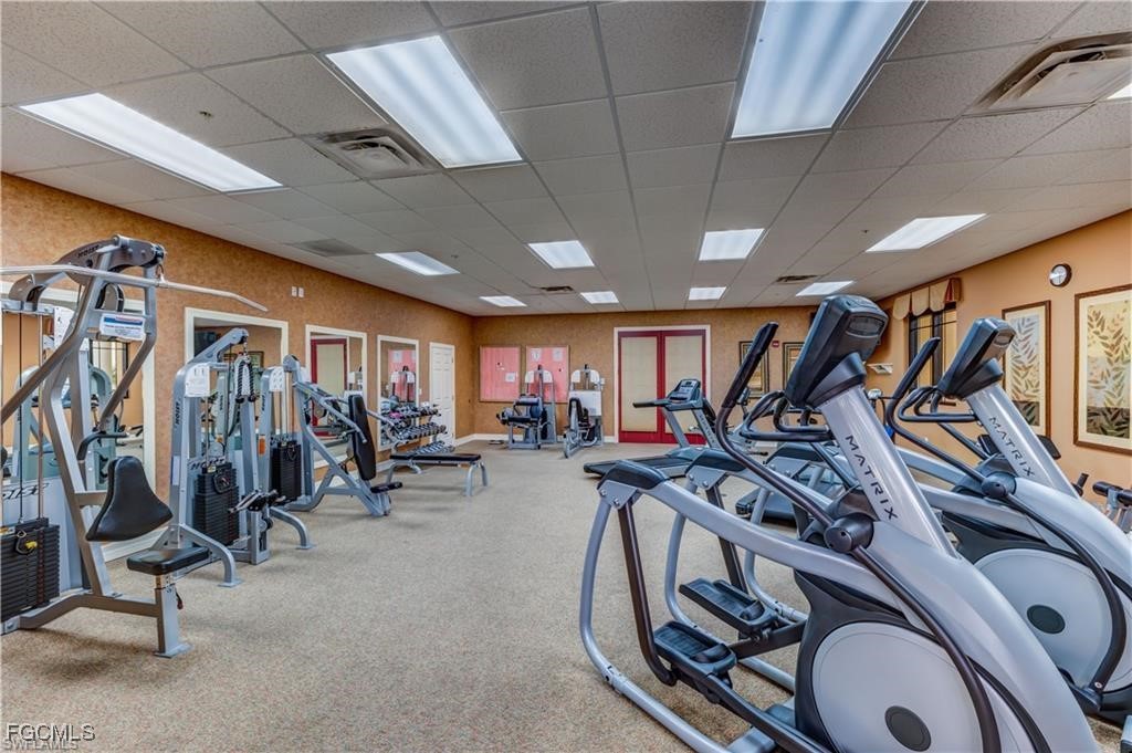 8261 Pathfinder Loop, Unit 730 Fort Myers, FL 33919 - Photo 29 of 40 a view of a room with gym equipment