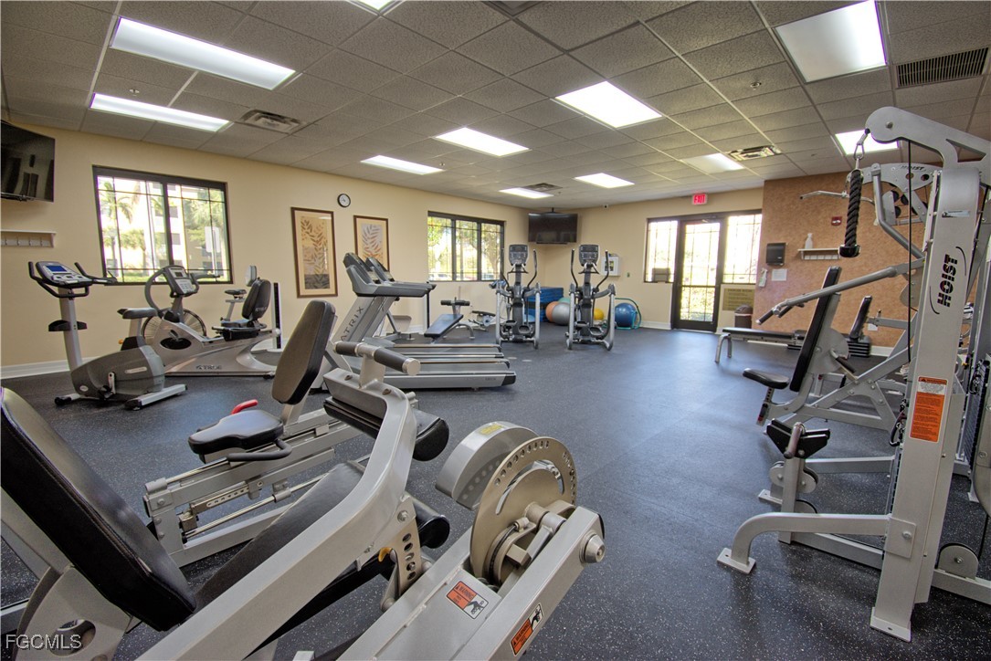 8261 Pathfinder Loop, Unit 730 Fort Myers, FL 33919 - Photo 30 of 40 a view of a room with gym equipment